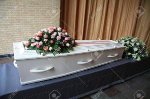 Ритуальные перевозки 10433842-a-whtie-coffin-with-pink-flowers-at-a-funeral-service.jpg